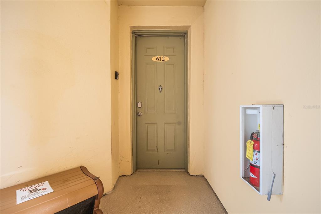 612 Terrace Ridge Circle, Unit 612 Davenport, FL 33896 - Photo 2 of 45 a view of an entryway with wooden floor