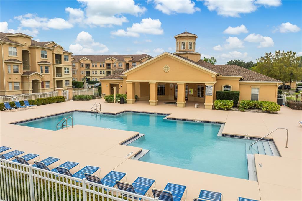 612 Terrace Ridge Circle, Unit 612 Davenport, FL 33896 - Photo 34 of 45 a view of a house with a swimming pool