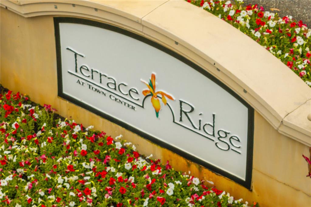 612 Terrace Ridge Circle, Unit 612 Davenport, FL 33896 - Photo 39 of 45 a sign on the side of a building