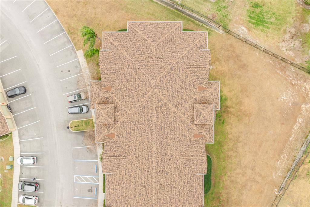 612 Terrace Ridge Circle, Unit 612 Davenport, FL 33896 - Photo 43 of 45 a bathroom with a shower curtain