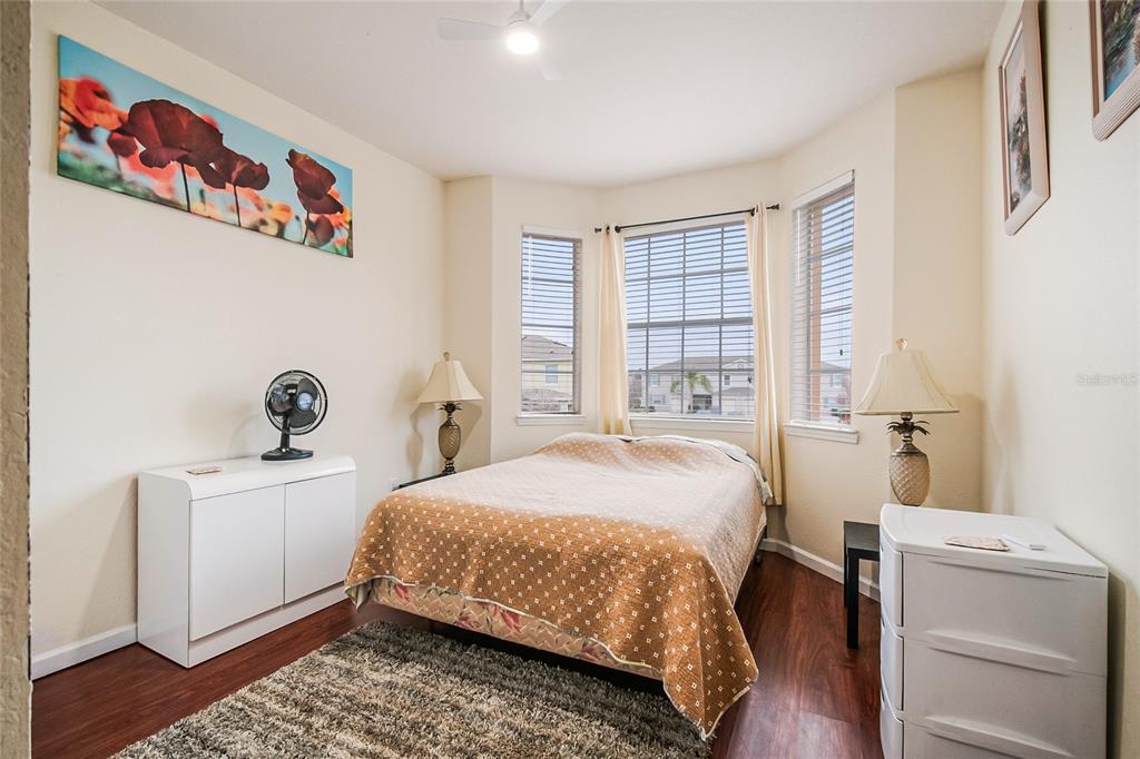 612 Terrace Ridge Circle, Unit 612 Davenport, FL 33896 - Photo 8 of 45 a bedroom with a bed and a window