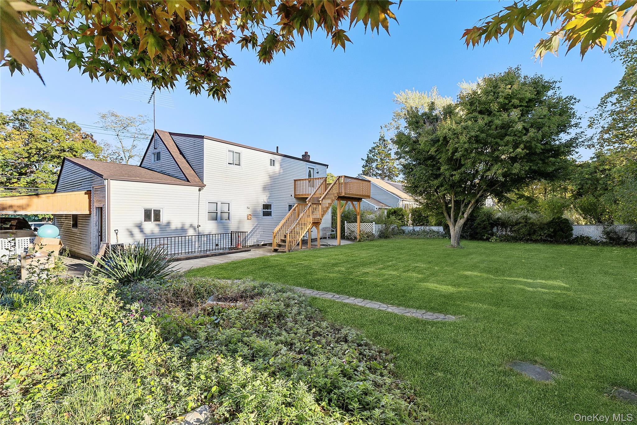 738 Old Town Road Port Jefferson Station, NY 11776 - Photo 27 of 28 a view of a house with backyard and garden
