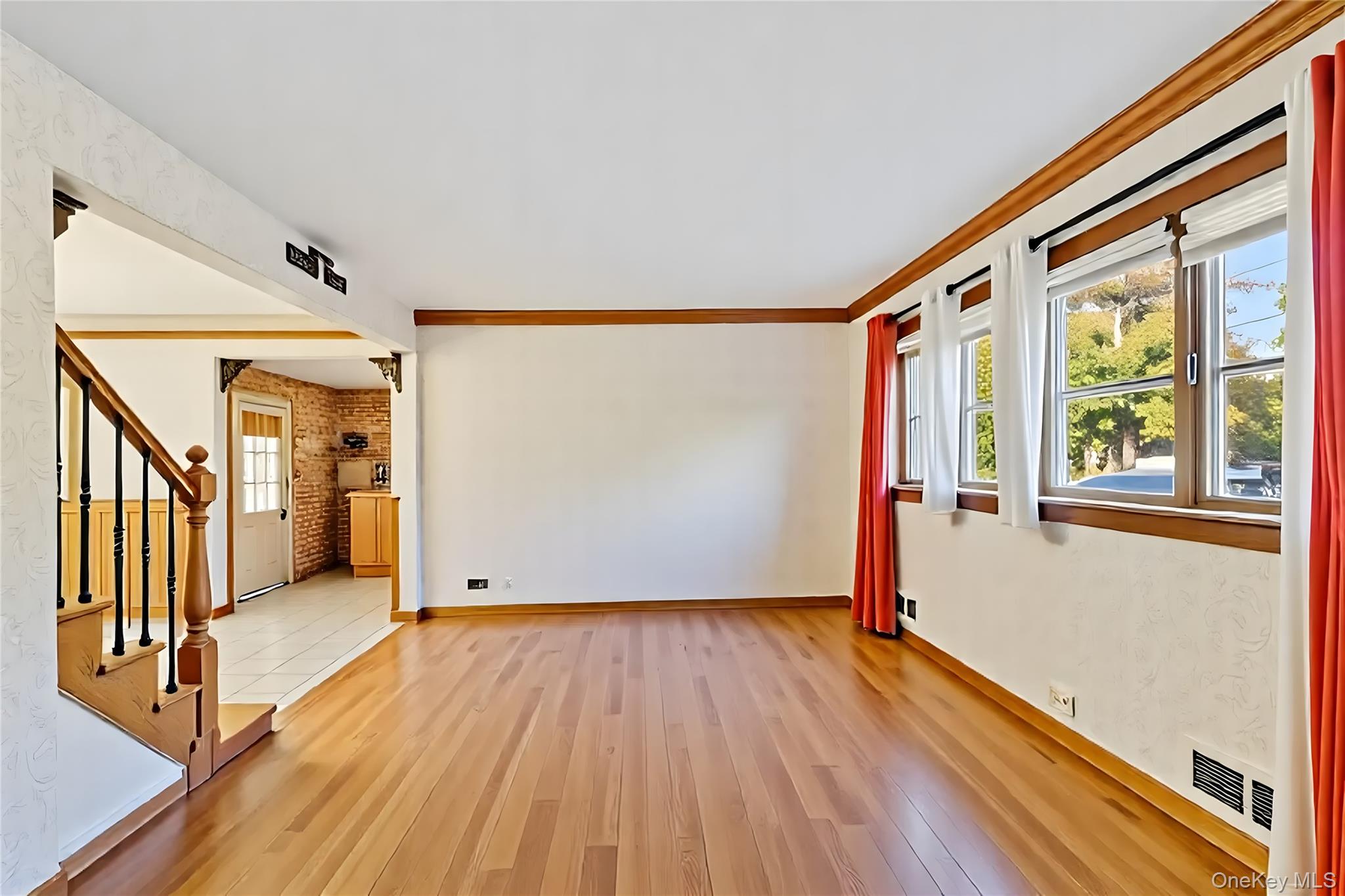 738 Old Town Road Port Jefferson Station, NY 11776 - Photo 5 of 28 a view of entryway with wooden floor and stairs