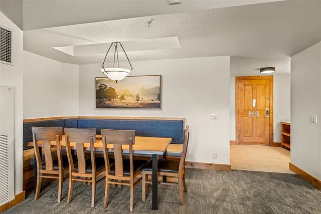 a kitchen with stainless steel appliances granite countertop a stove microwave and sink