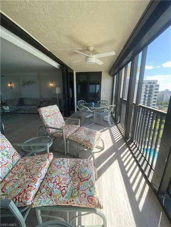 a view of balcony with wooden floor