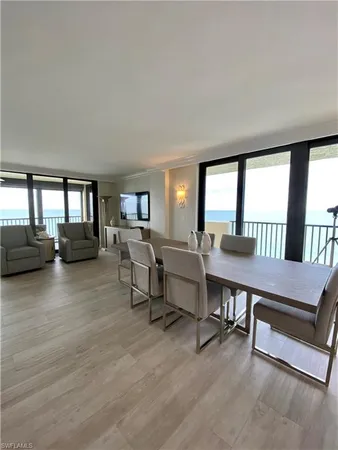 a view of a livingroom with furniture and a hardwood floor