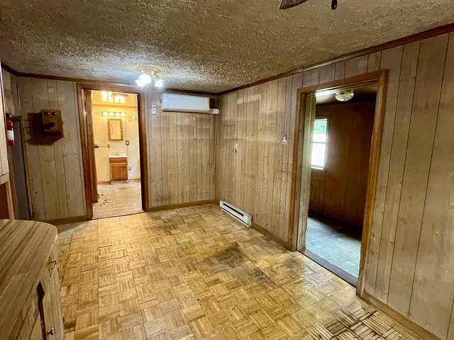 a view of a hallway with wooden shelves