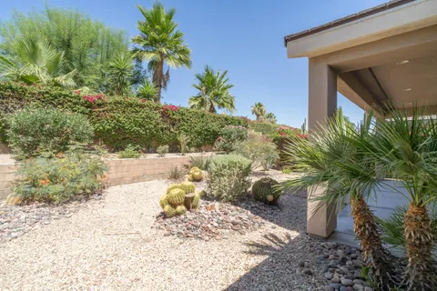 a view of a backyard of the house