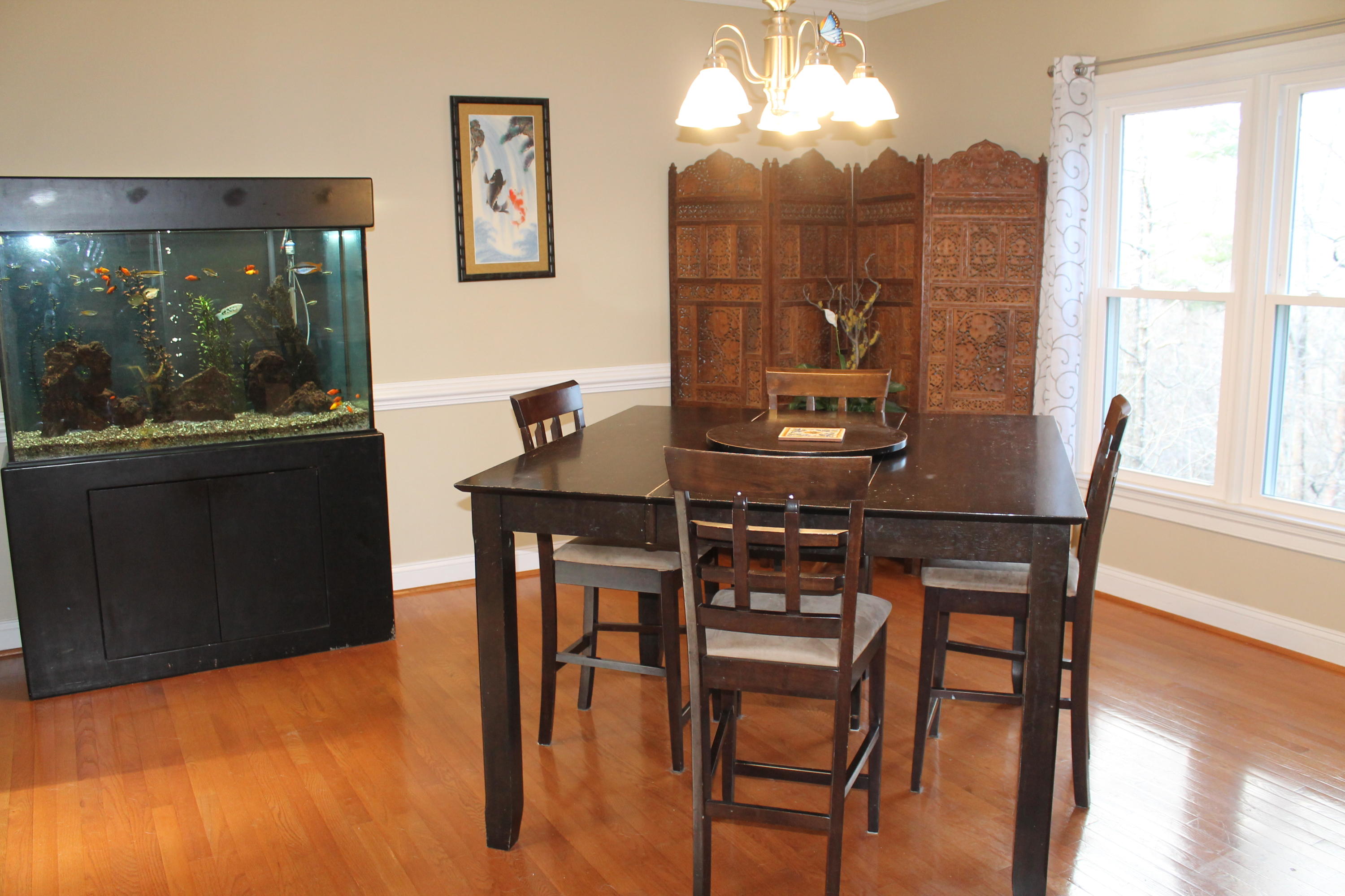 6715 Fairway Ridge Road Roanoke, VA 24018 - Photo 11 of 35 a view of a dining room with furniture window and wooden floor