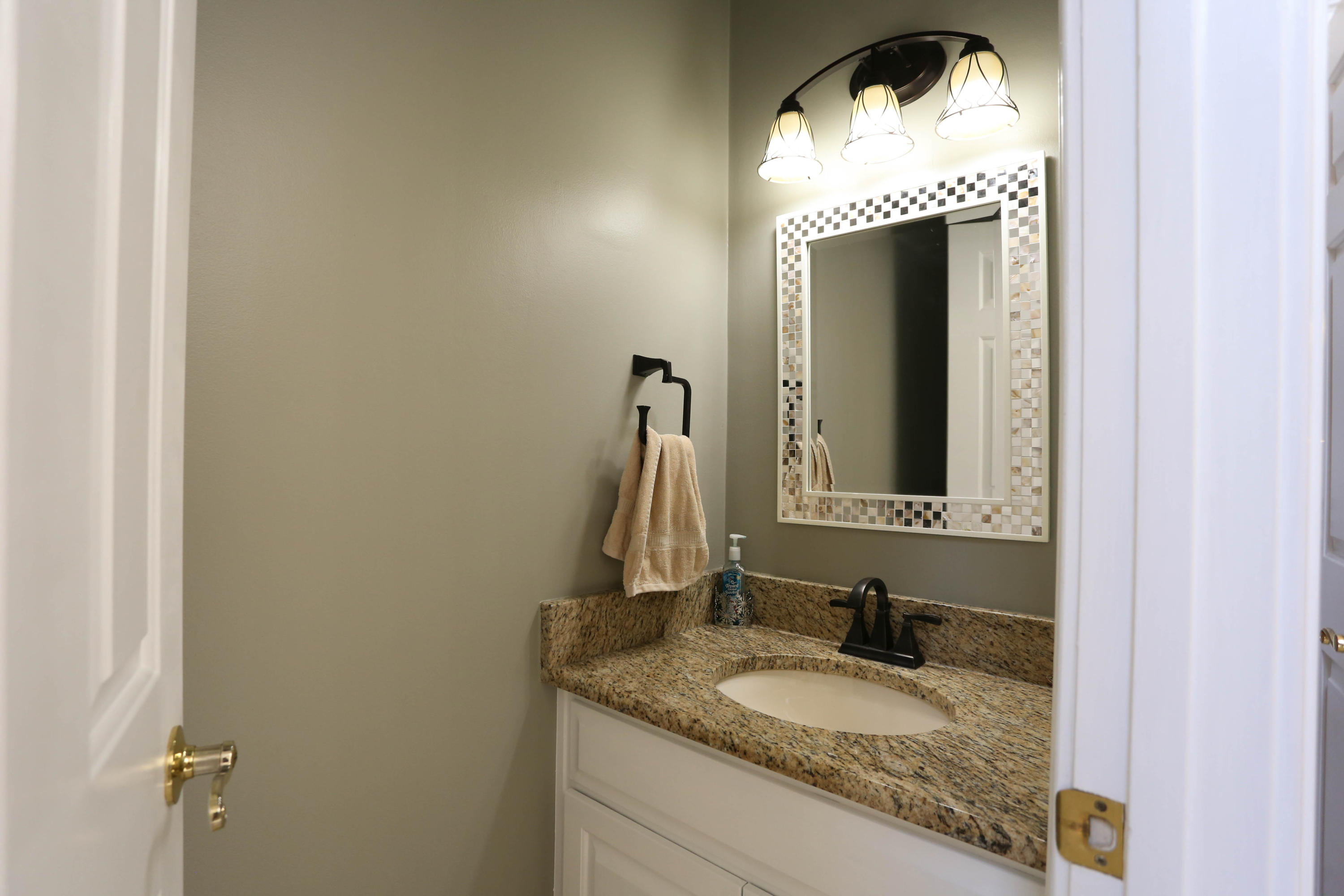 6715 Fairway Ridge Road Roanoke, VA 24018 - Photo 13 of 35 a bathroom with a granite countertop sink and a mirror