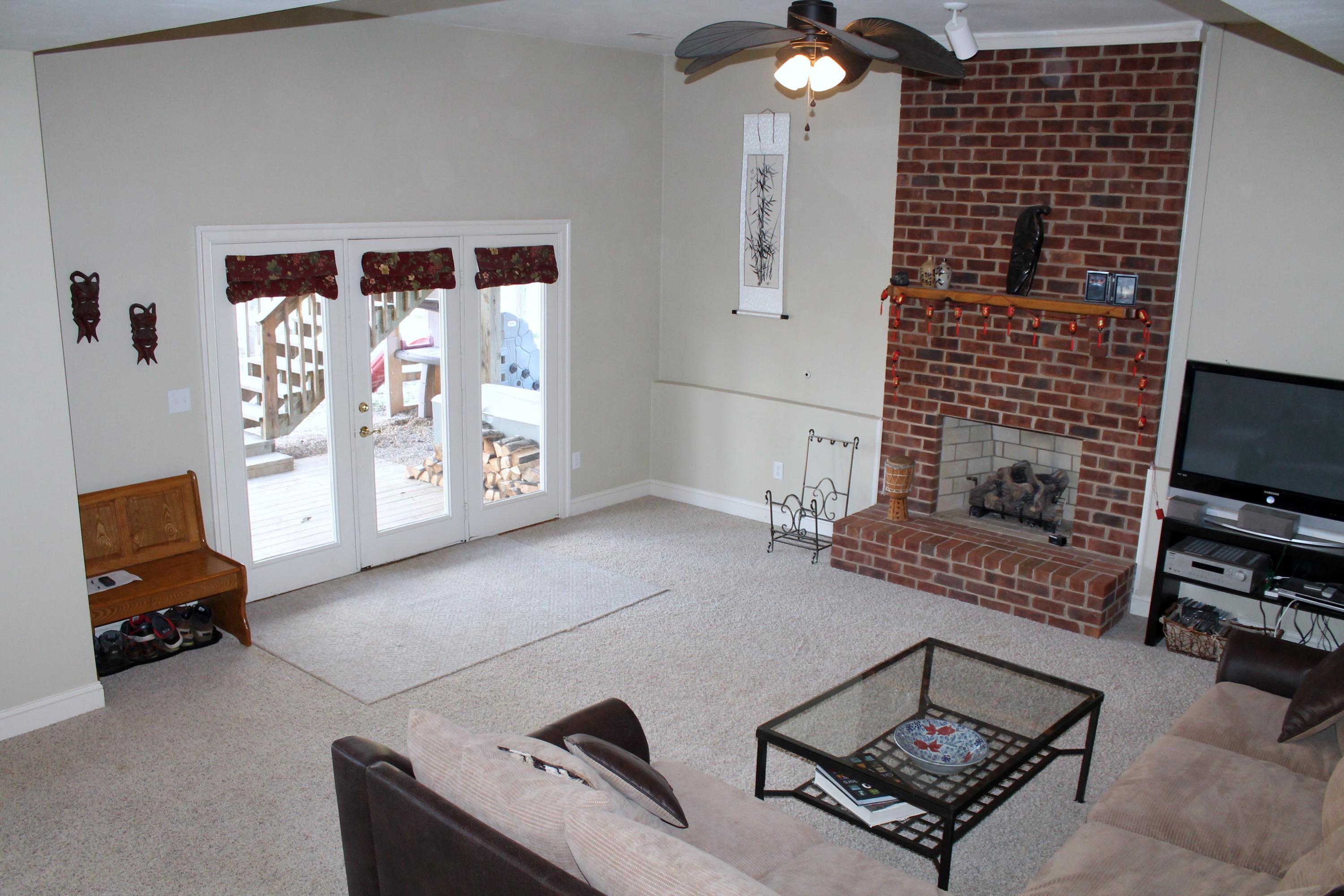 6715 Fairway Ridge Road Roanoke, VA 24018 - Photo 23 of 35 a living room with furniture and a flat screen tv