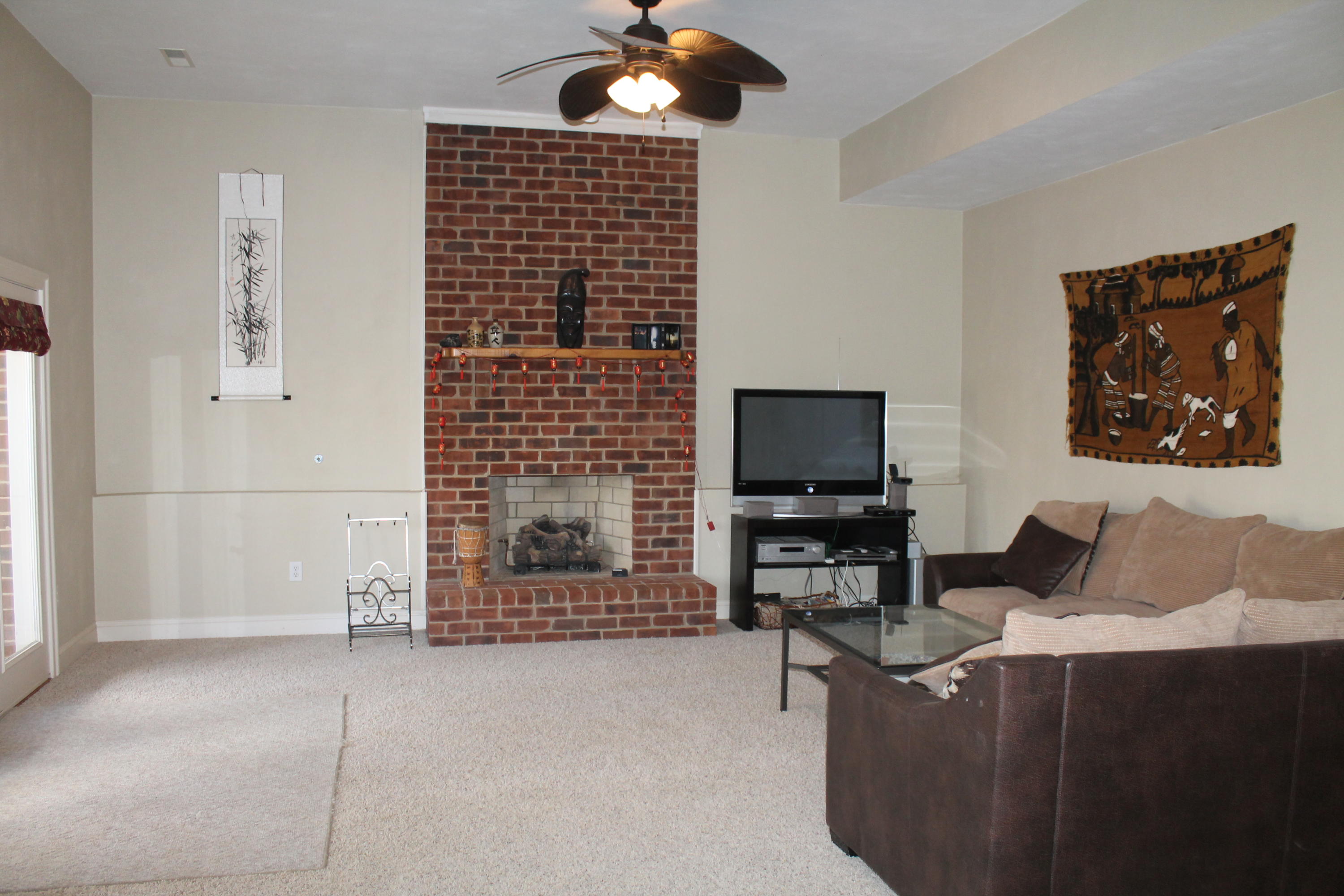 6715 Fairway Ridge Road Roanoke, VA 24018 - Photo 24 of 35 a living room with furniture and a flat screen tv
