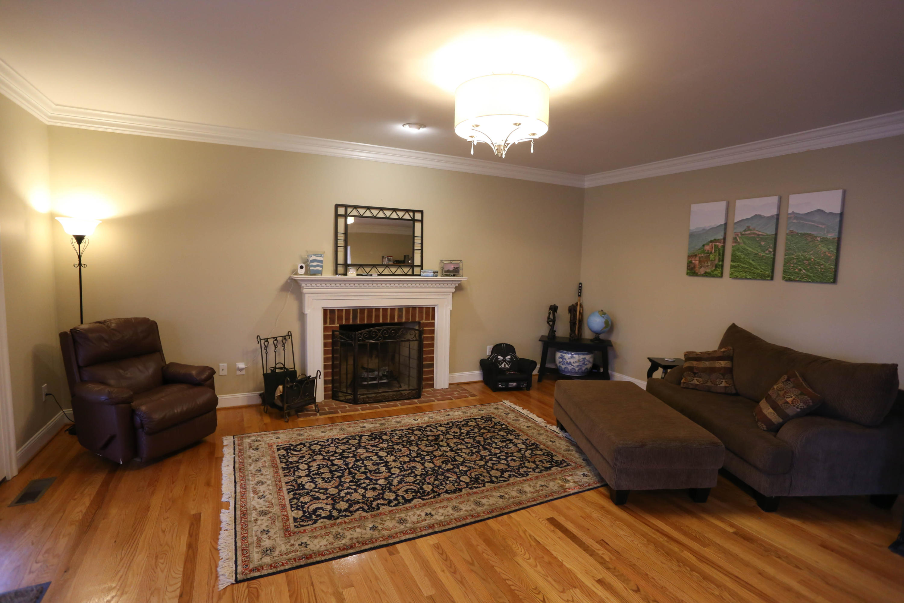 6715 Fairway Ridge Road Roanoke, VA 24018 - Photo 5 of 35 a living room with furniture a fireplace and a flat screen tv