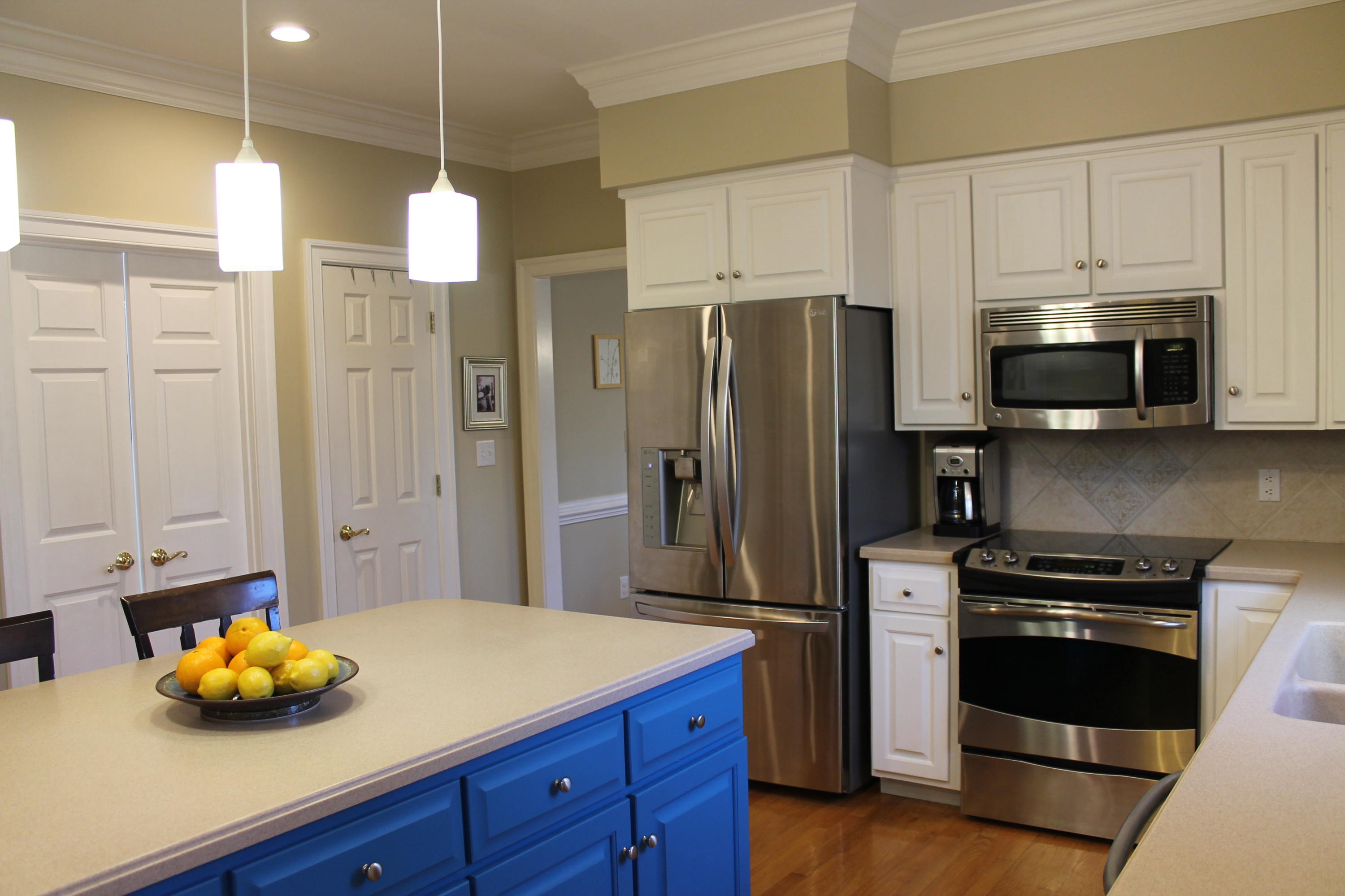 6715 Fairway Ridge Road Roanoke, VA 24018 - Photo 9 of 35 a kitchen with stainless steel appliances granite countertop a refrigerator a sink a stove and white cabinets