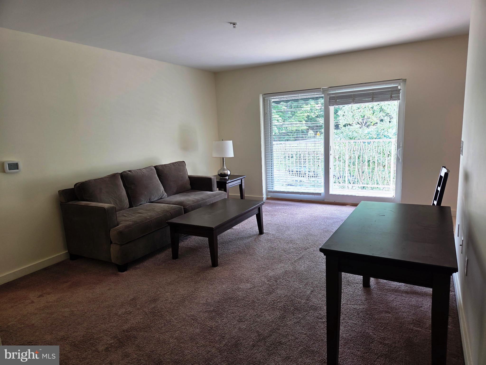 1600 Church Road, Unit B301 Wyncote, PA 19095 - Photo 4 of 14 Living Room with sliders to balcony