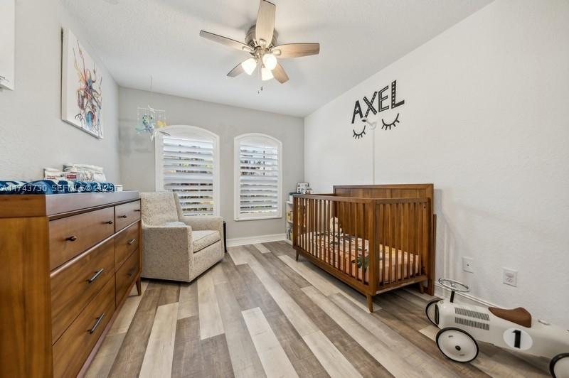 8911 Chestnut Ridge Way Boynton Beach, FL 33473 - Photo 13 of 20 a bedroom with furniture and a window