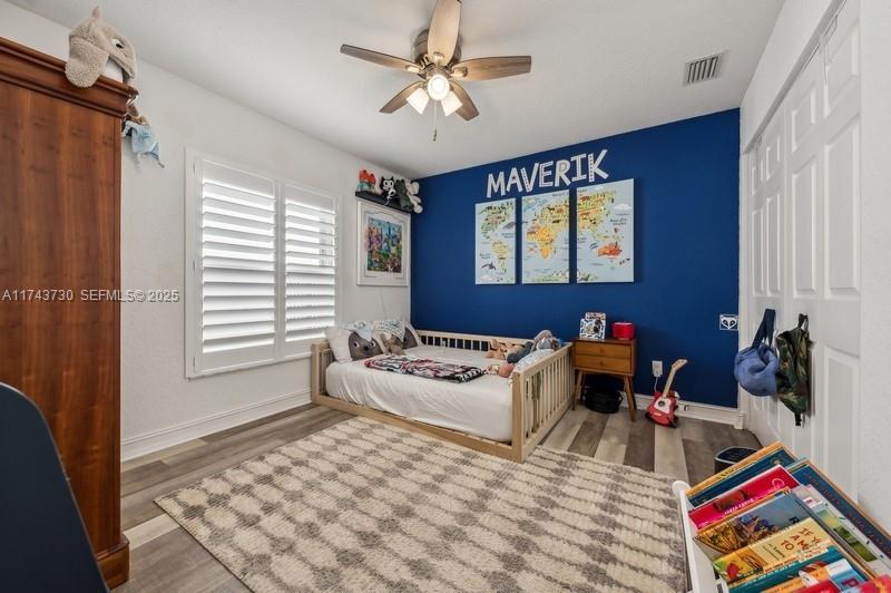 8911 Chestnut Ridge Way Boynton Beach, FL 33473 - Photo 14 of 20 a bedroom with furniture and a window