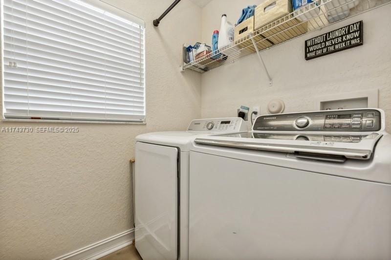 8911 Chestnut Ridge Way Boynton Beach, FL 33473 - Photo 17 of 20 a utility room with dryer and washer