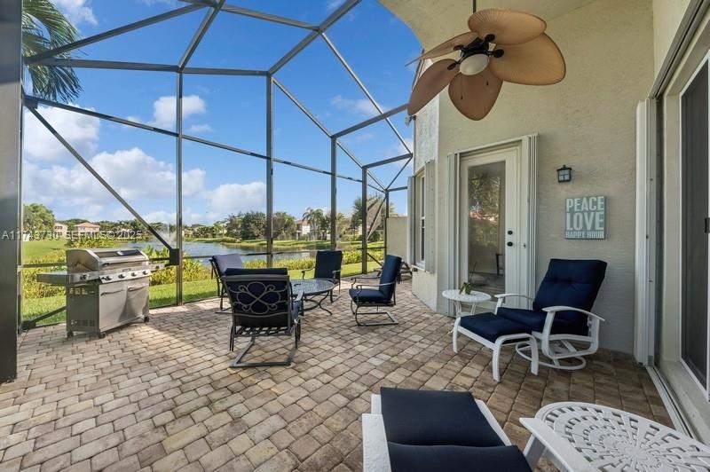 8911 Chestnut Ridge Way Boynton Beach, FL 33473 - Photo 19 of 20 a view of outdoor dining space with a patio
