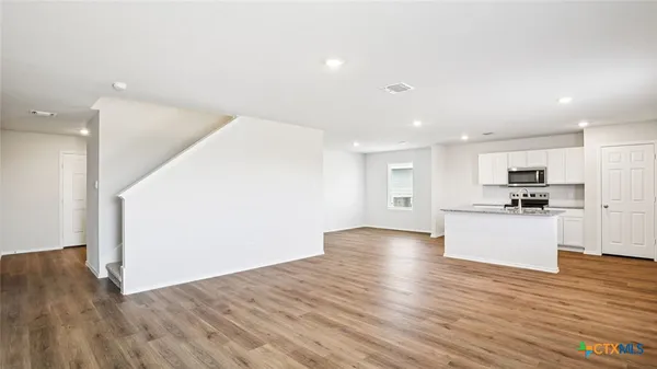 a view of kitchen with wooden floor