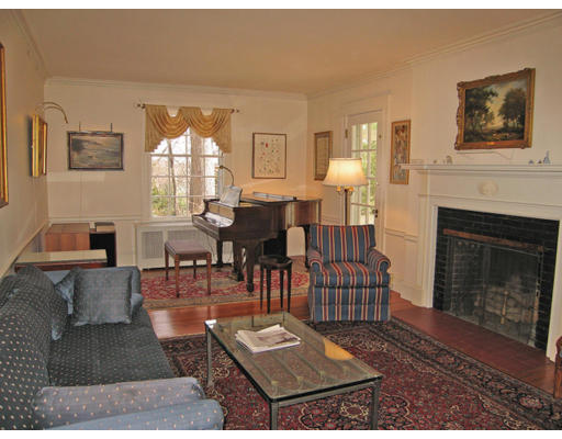 54 Gammons Road Newton, MA 02468 - Photo 2 of 9 a living room with furniture and a fireplace