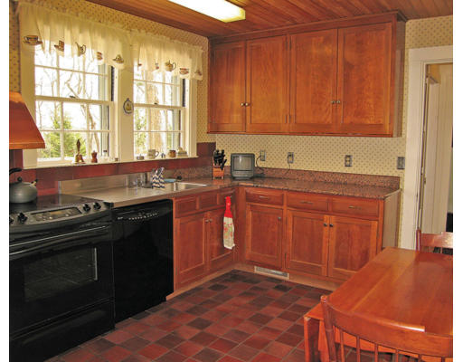 54 Gammons Road Newton, MA 02468 - Photo 5 of 9 a kitchen with stainless steel appliances a stove a sink and a microwave