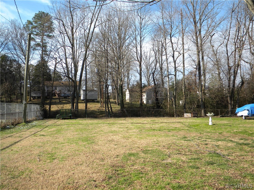 4602 Mizar Road Henrico, VA 23231 - Photo 13 of 13 a swimming pool with trees in the background