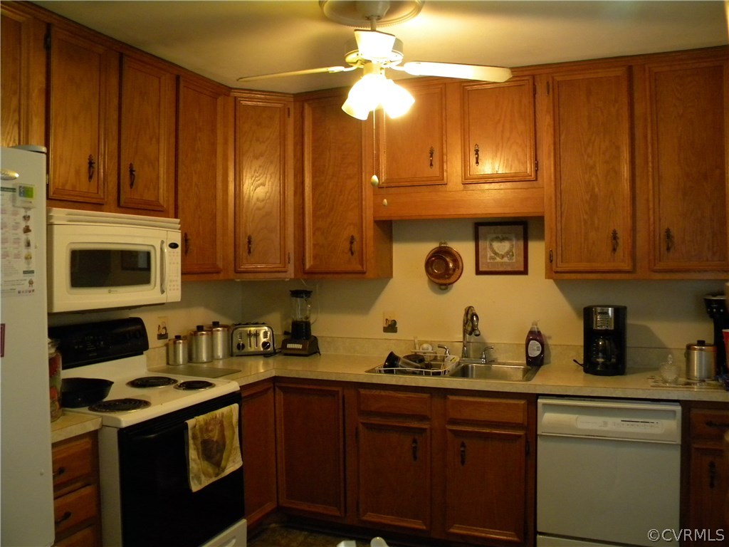 4602 Mizar Road Henrico, VA 23231 - Photo 2 of 13 a kitchen with stainless steel appliances granite countertop a sink a stove cabinets and a refrigerator