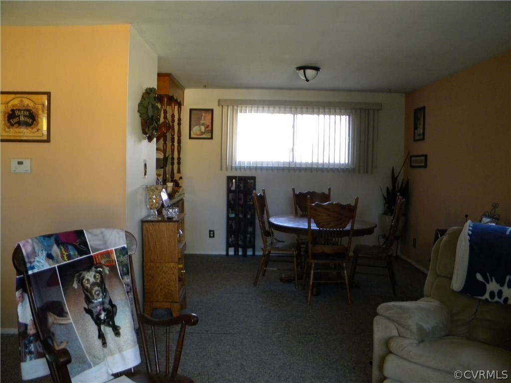4602 Mizar Road Henrico, VA 23231 - Photo 3 of 13 a view of a workspace with furniture and a window