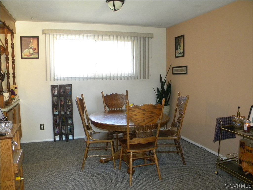 4602 Mizar Road Henrico, VA 23231 - Photo 4 of 13 a view of a dining room with furniture and a window