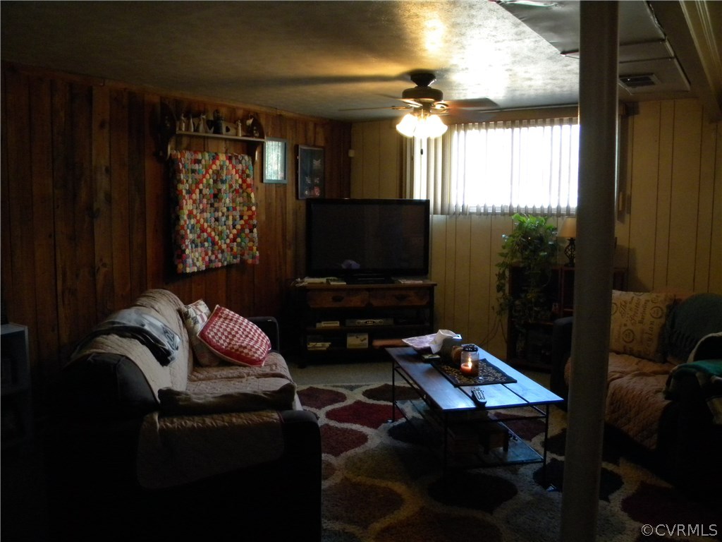 4602 Mizar Road Henrico, VA 23231 - Photo 6 of 13 a living room with furniture and a flat screen tv