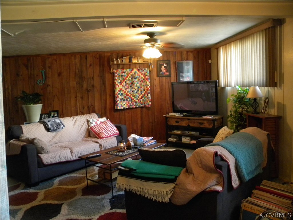 4602 Mizar Road Henrico, VA 23231 - Photo 7 of 13 a living room with furniture a window and a flat screen tv