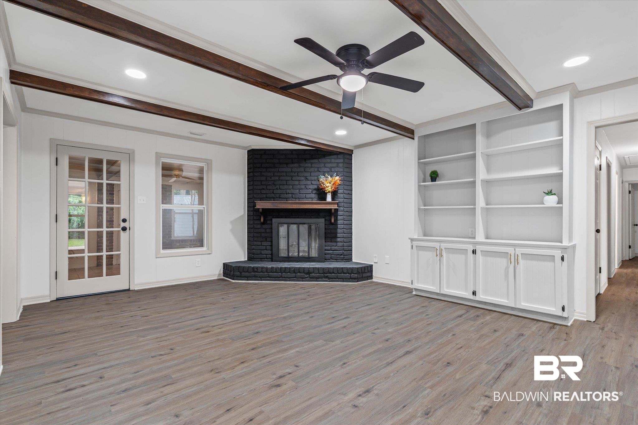 3655 Claridge Road South Mobile, AL 36608 - Photo 10 of 32 Unfurnished living room featuring beam ceiling, light wood finished floors, recessed lighting, a brick fireplace, and ceiling fan