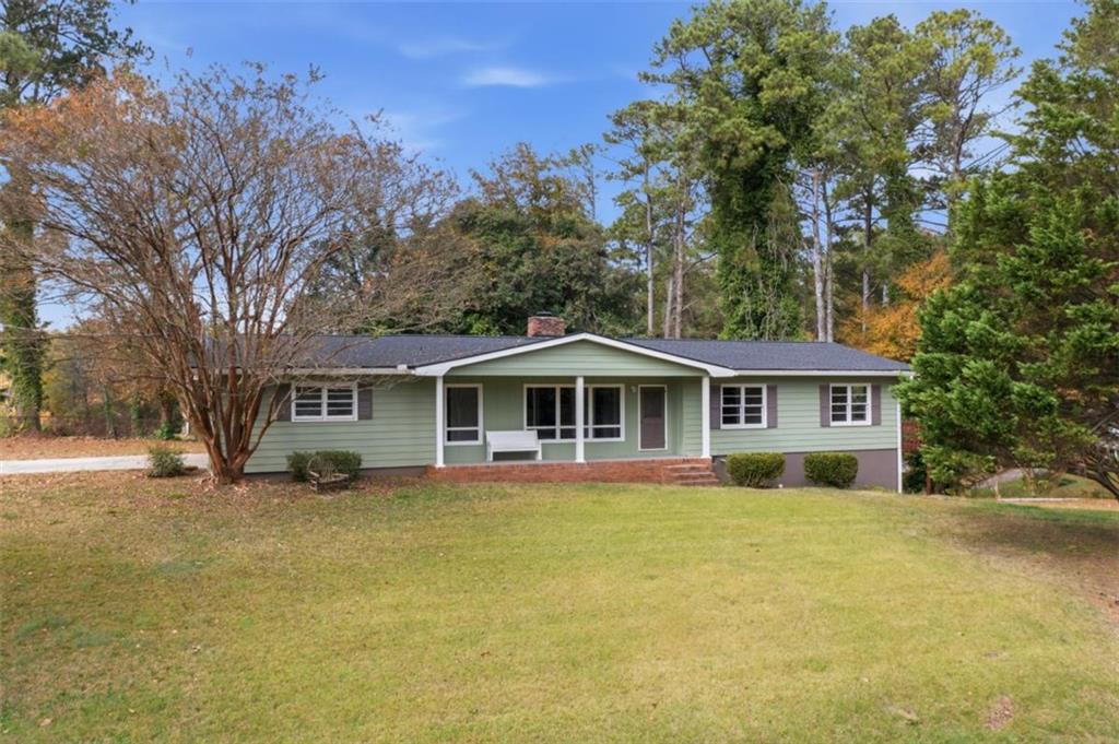 14 Mitchell Circle Southeast Rome, GA 30161 - Photo 2 of 39 a view of a house with a big yard and large trees