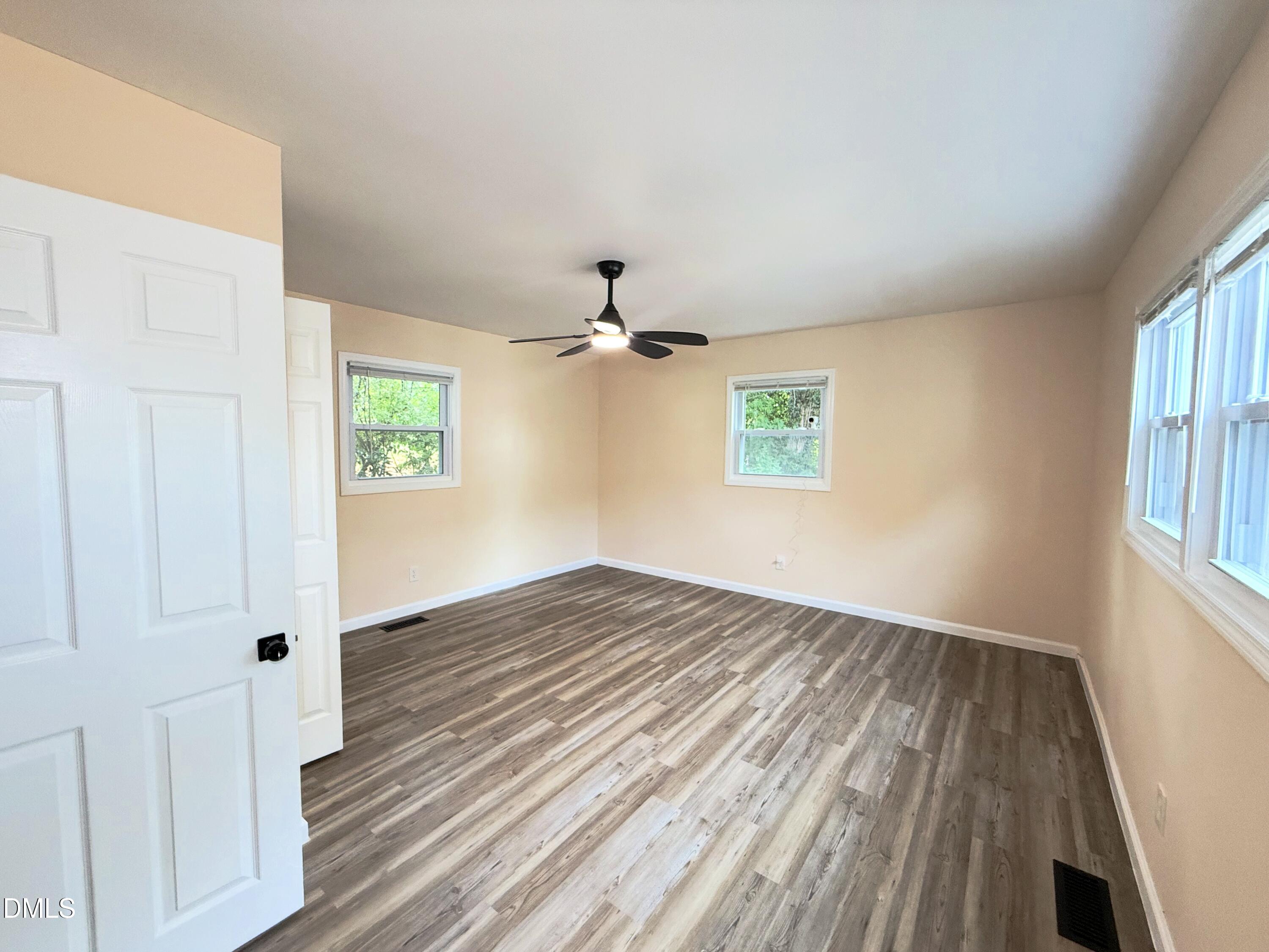 417 North Street Graham, NC 27253 - Photo 4 of 18 wooden floor in an empty room with a window