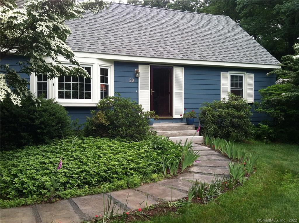 29 Woods Road Bloomfield, CT 06002 - Photo 1 of 1 a front view of a house with a garden