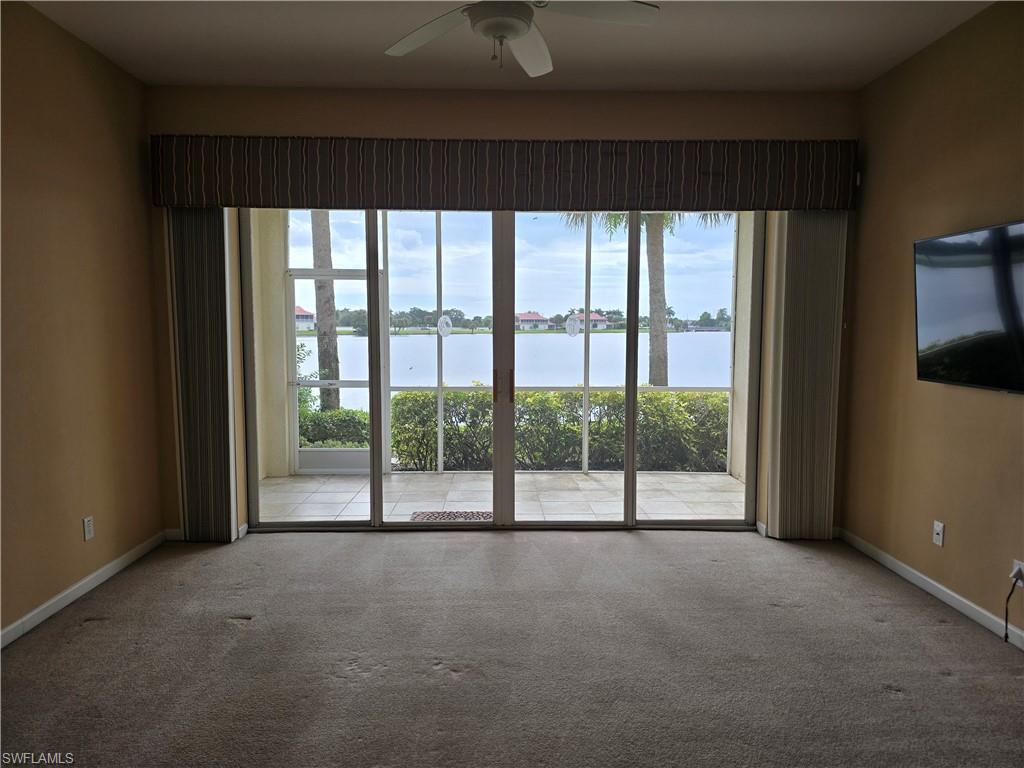 25069 Peacock Lane, Unit 101 Naples, FL 34114 - Photo 2 of 49 a view of empty room with floor to ceiling window