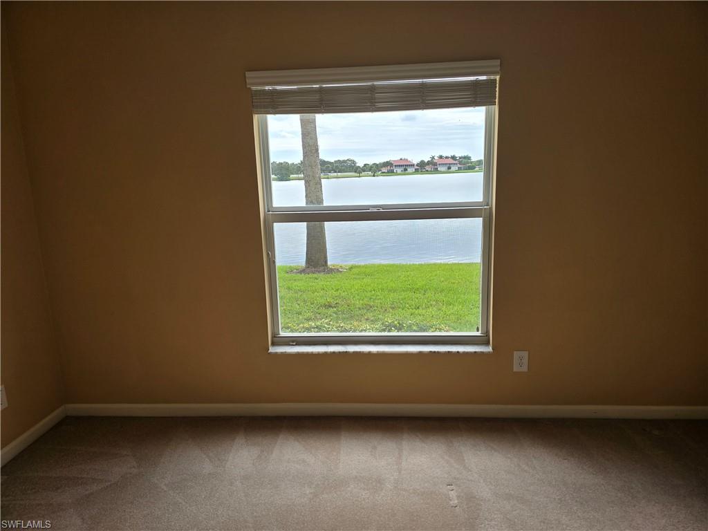 25069 Peacock Lane, Unit 101 Naples, FL 34114 - Photo 29 of 49 a view of an empty room with a window