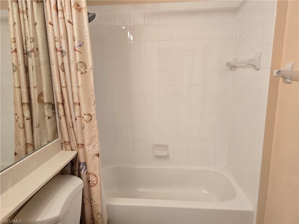 25069 Peacock Lane, Unit 101 Naples, FL 34114 - Photo 34 of 49 a close up of a bathtub curtain