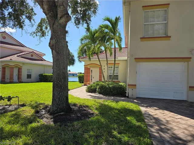 a kitchen with a stove top oven and cabinets