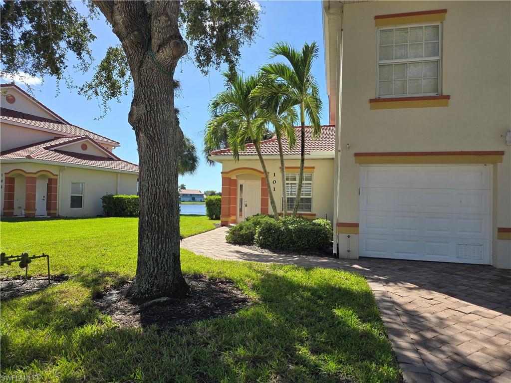 25069 Peacock Lane, Unit 101 Naples, FL 34114 - Photo 6 of 49 a view of a house with backyard and garden