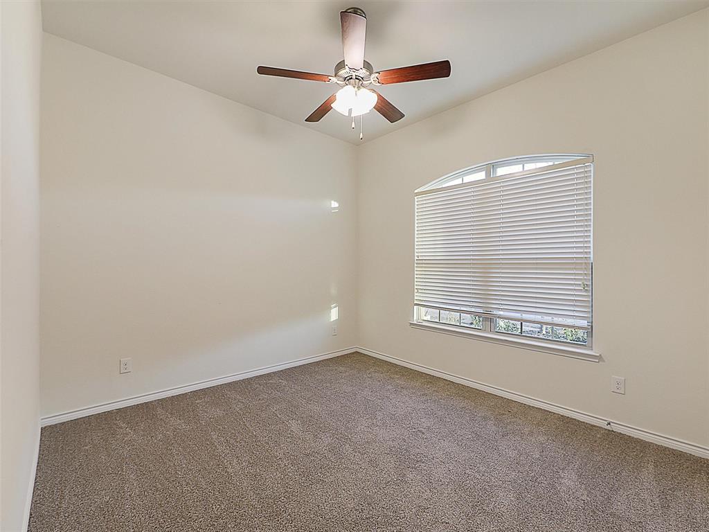 421 Maverick Street Anna, TX 75409 - Photo 17 of 25 Carpeted spare room featuring ceiling fan and baseboards
