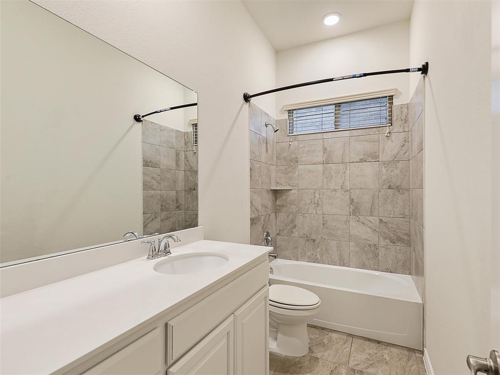 421 Maverick Street Anna, TX 75409 - Photo 21 of 25 Bathroom with vanity and shower combination