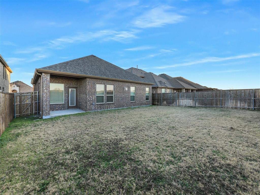 421 Maverick Street Anna, TX 75409 - Photo 24 of 25 Rear view of house with a patio, brick siding, a fenced backyard, a shingled roof, and a gate