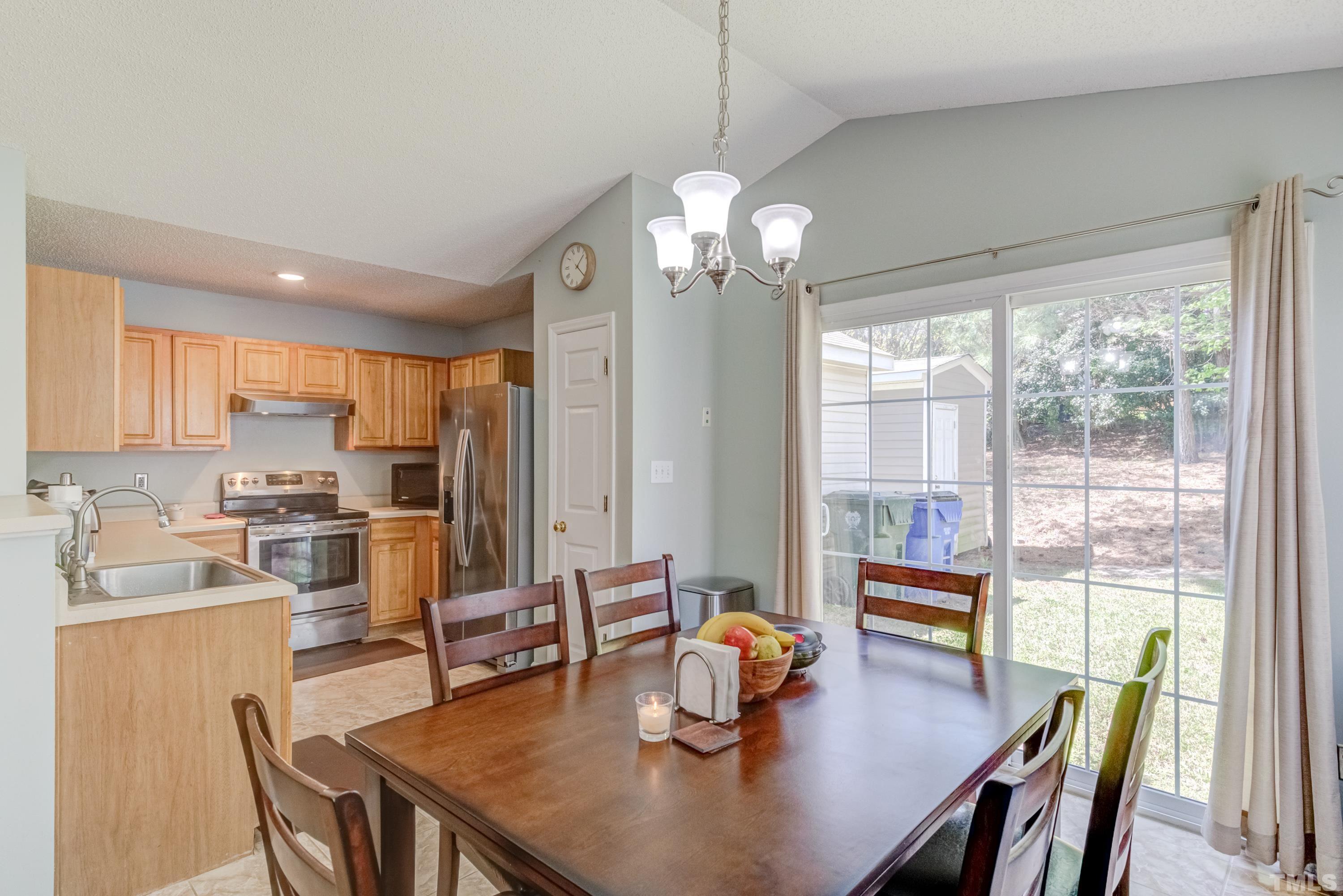 4917 Silverdene Street Raleigh, NC 27616 - Photo 15 of 37 a view of a dining room and livingroom view