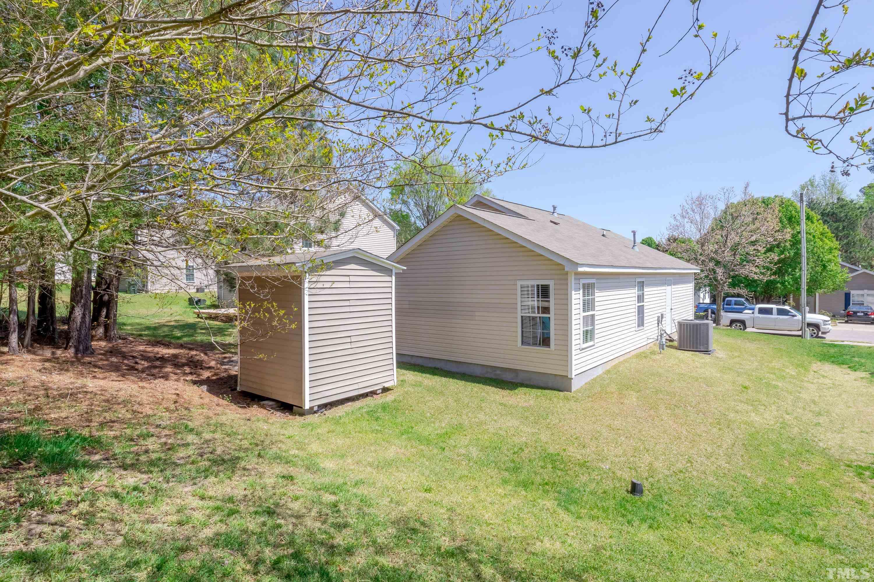 4917 Silverdene Street Raleigh, NC 27616 - Photo 35 of 37 a view of a house with a yard