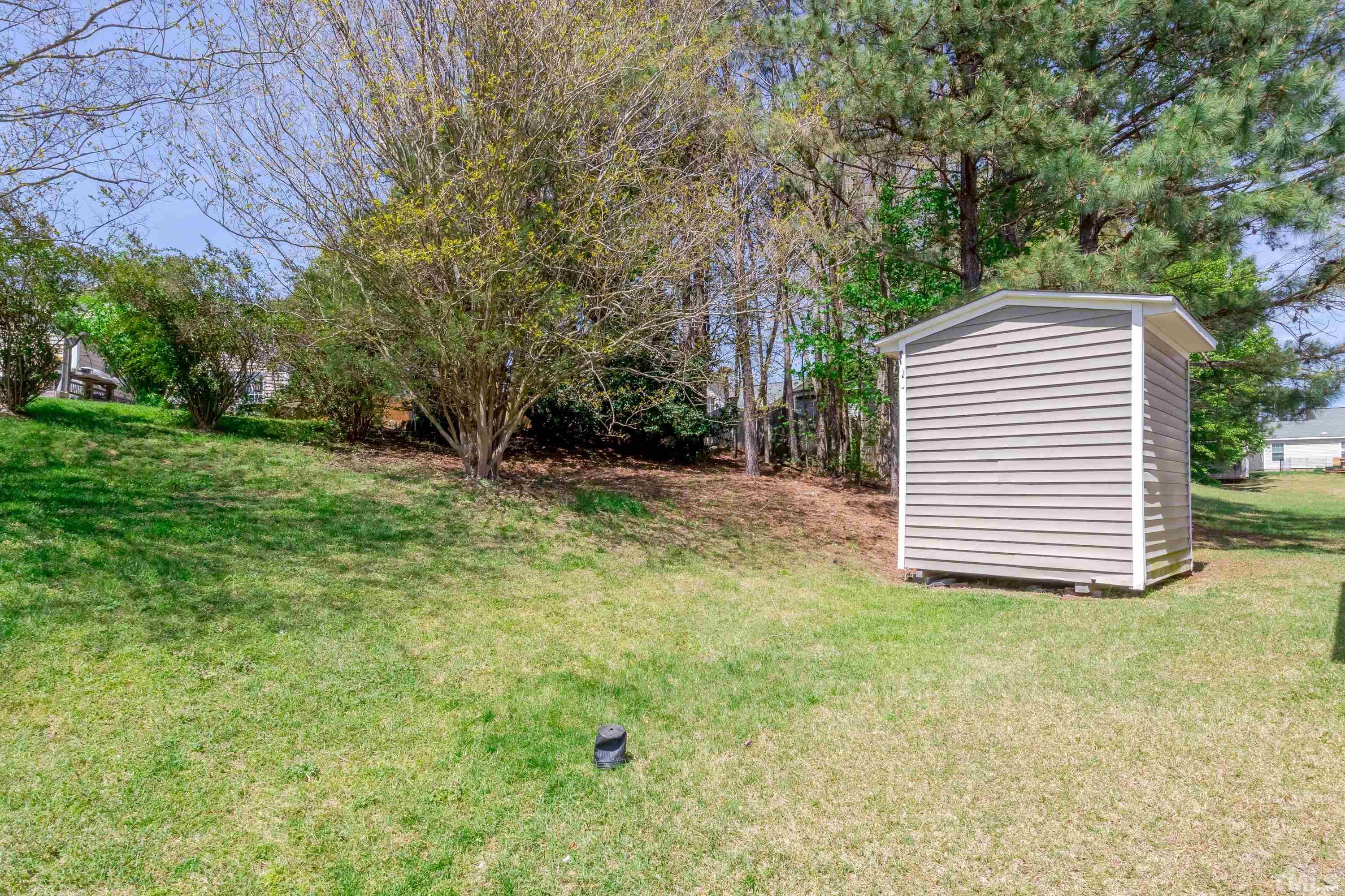 4917 Silverdene Street Raleigh, NC 27616 - Photo 36 of 37 a view of a house with a yard and an outdoor space