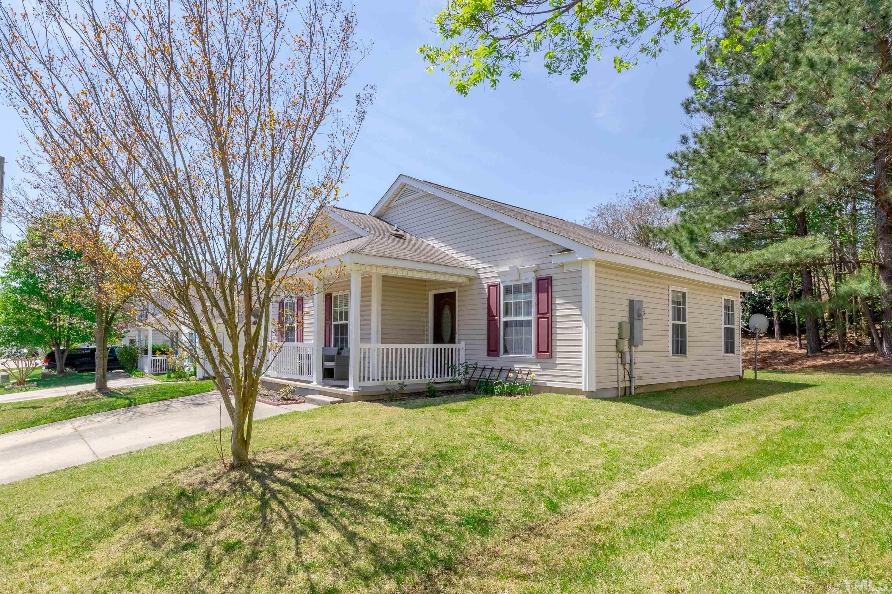 4917 Silverdene Street Raleigh, NC 27616 - Photo 4 of 37 a front view of a house with garden