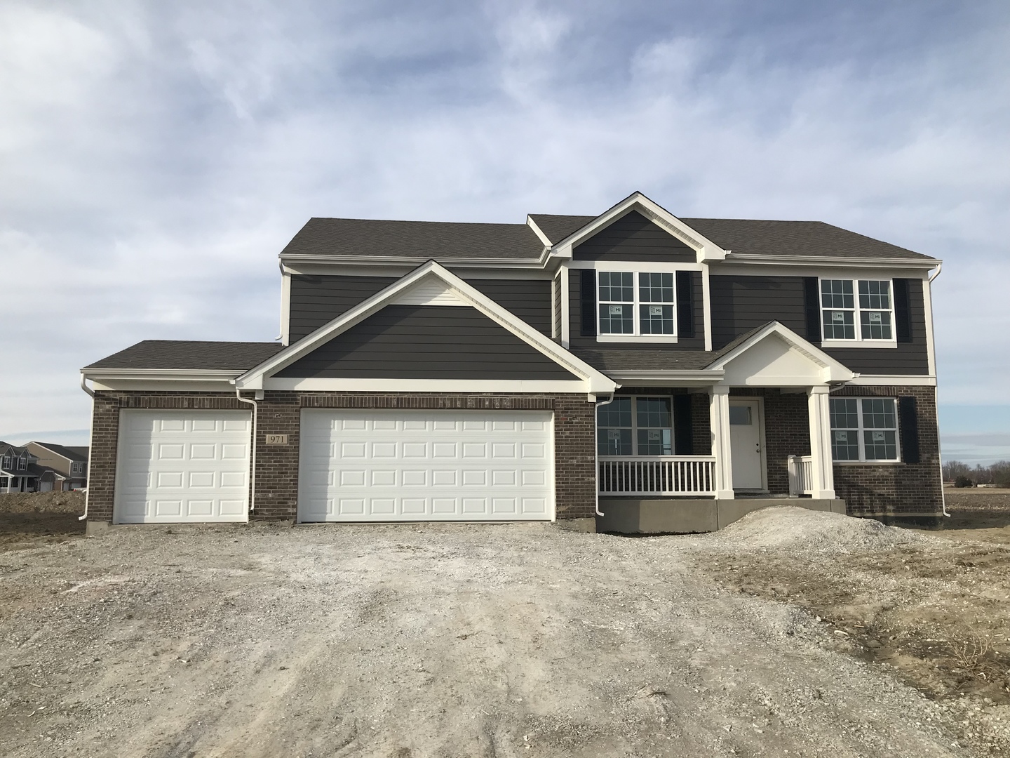 971 Redcliff Road New Lenox, IL 60451 - Photo 1 of 51 a front view of a house with a yard and garage