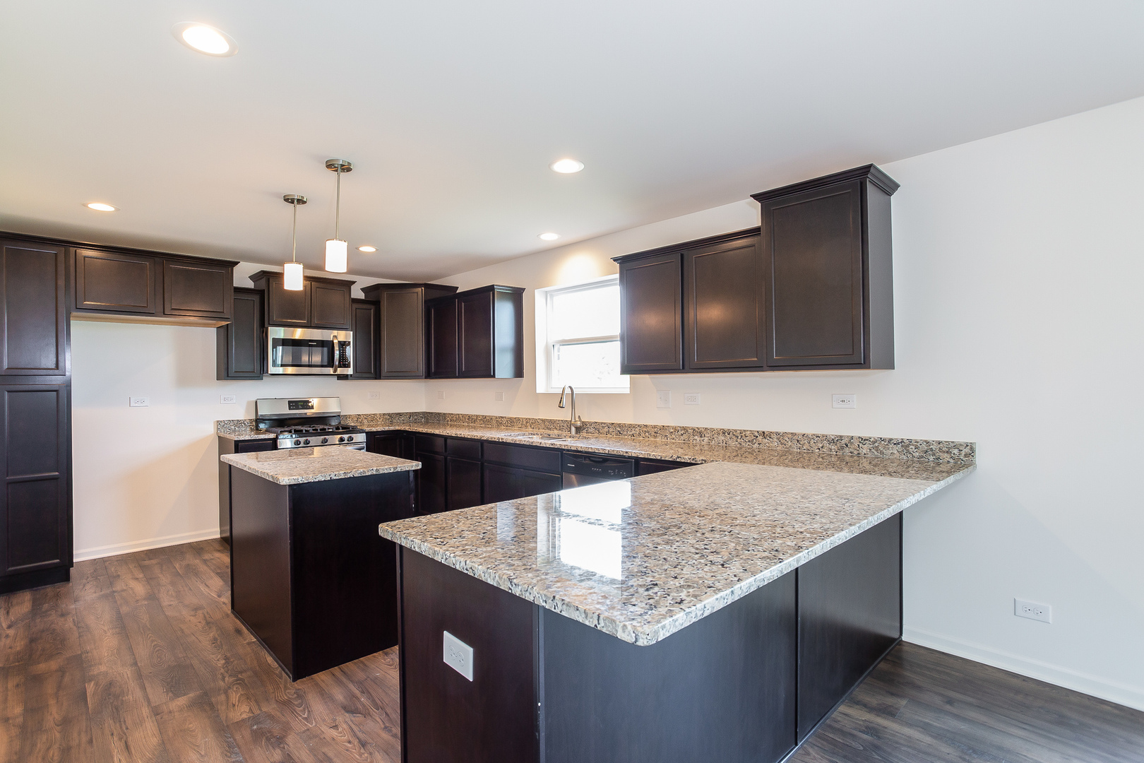 971 Redcliff Road New Lenox, IL 60451 - Photo 2 of 51 a kitchen with stainless steel appliances granite countertop a kitchen island a stove and a sink